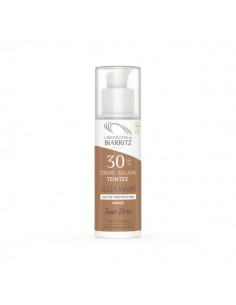 Crema solar facial color...