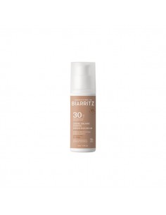 Crema solar facial color...
